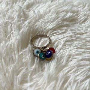 “Evil eye” ring with multiple color eyes.